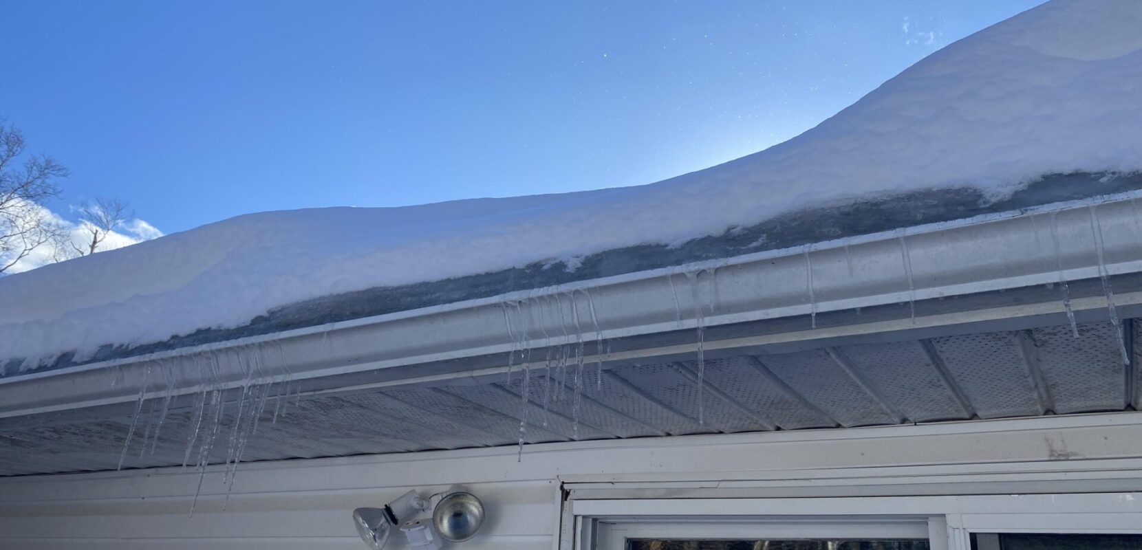 Heavy snow on gutters